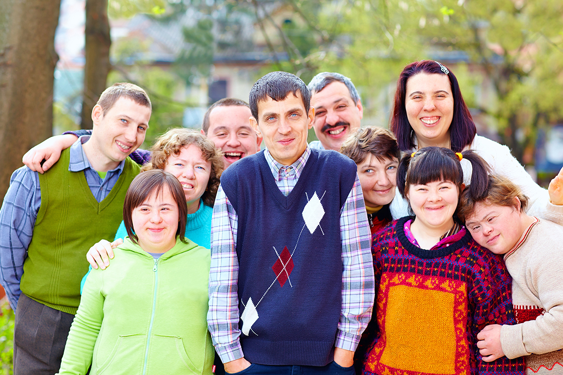 group of happy people with disabilities